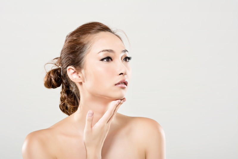 Woman with beautiful facial features and expressive eyes.