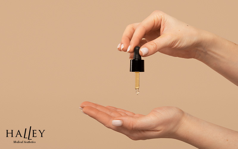Applying serum to treat sun-damaged skin.