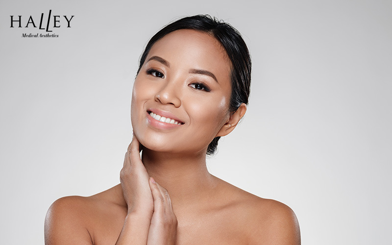 Happy woman with glowing skin after Pico laser.