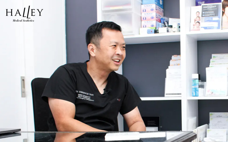 Dr. Terence Tan consulting on laser skin treatments.